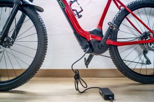 electric-mountain-bike-charging-battery-next-to-royalty-free-image-1641931498